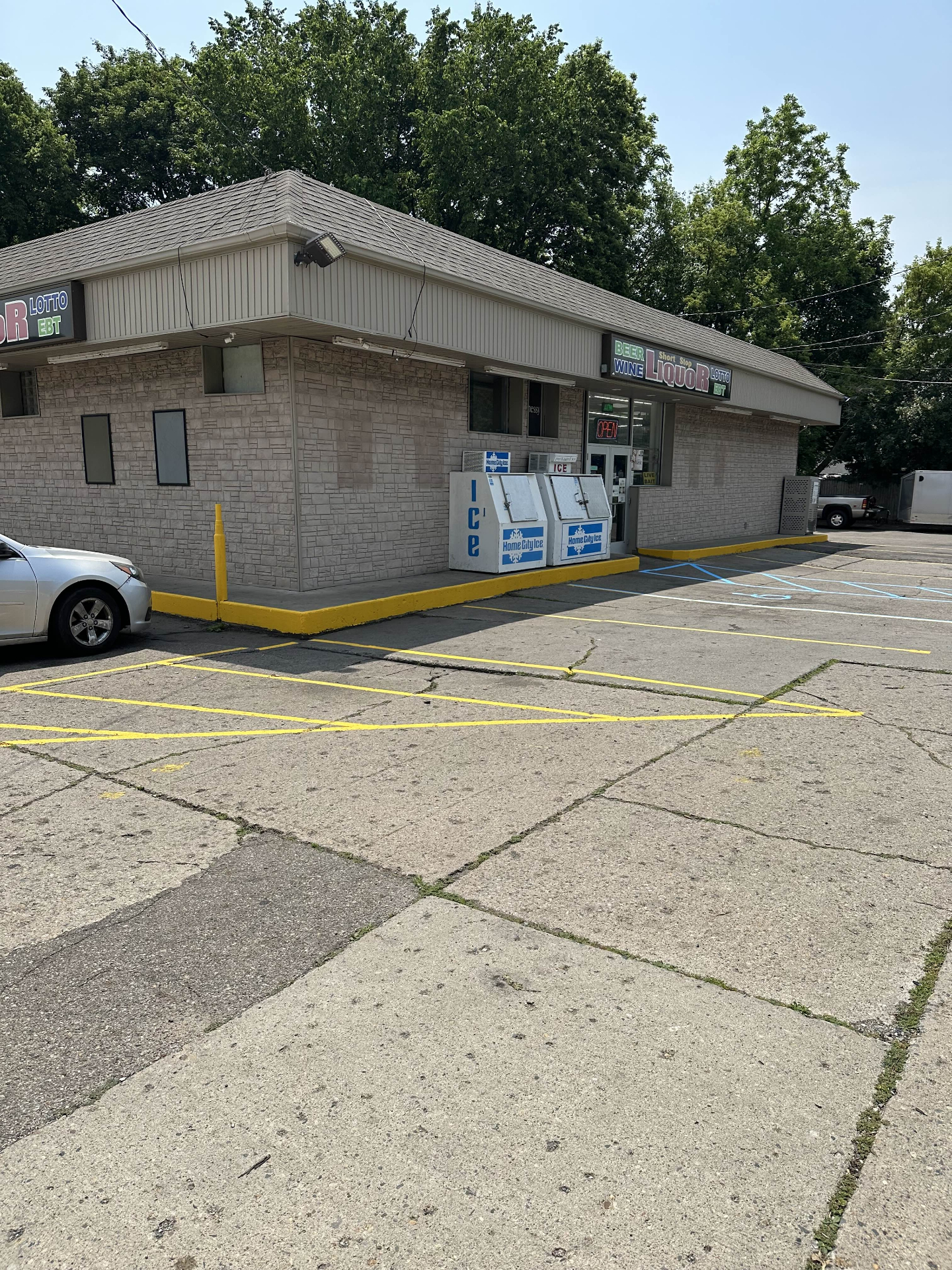 Parking lot after striping with fresh yellow lines and ADA markings