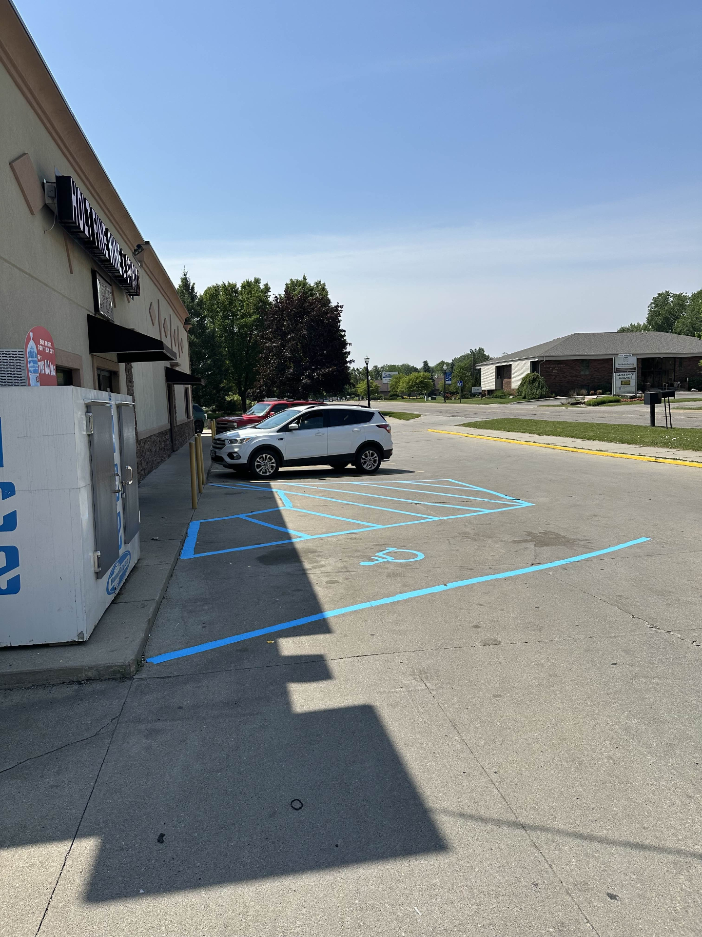 Fresh blue handicap striping with yellow lines